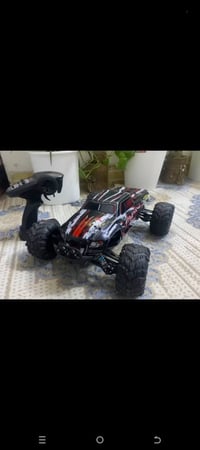سيارة للبيع مع بطاريه اضافيه   احترافيه سباق تعمل بالتحكم عن بعد بمقيا...