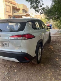 كورلا كروس هايبرد 2024 محرك 2000 ماشية 38 الف KM بصمة  قمارة حديد  الس...