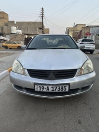 لانسر 2010 خليجي بدون ضربه او صبغ بيهه طخات بسيطه كير محرك جدد  تبريد ...