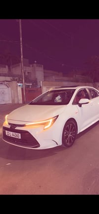 كورلا تجميع صيني هايبرد 2025 داخل احمر جلد كشن السايق كهرباء السياره ف...