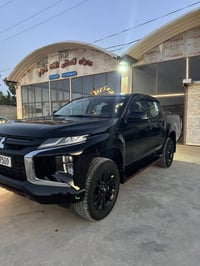 L200 موديل23 كاز ك/م. 58  عليها حمايهPPF   رقم بغداد    07730200342