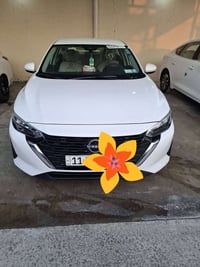 للبيع نيسان سنترا رقم بغداد موديل ٢٠٢٤ تبديل باب سيق  رقم تلفون اتصل ع...