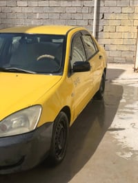 لانسر ٢٠١٠ صفره مكينه حاويه وكير مكفولات صدر أمامي خلفي جديد تخم تاير ...