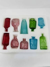 مزهريات زجاجية • ١٢ قطعة • زينة مركزية