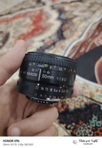 عدسة 50mm • فتحة f1.8 • لنيكون