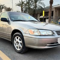 كامري موديل 2001 وارد امريكي  للبيع فقط حادث امريكه الجاملغ والباب الخ...