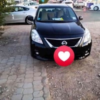 للبيع او المراوسه ويه كيه كارنز نيسان فيرسا موديل 12 رقم بغداد مشروع و...