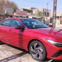 هيونداي النترا هايبرد 25 لون احمر الداخل ابيض السيارة فول الفول للأخير...