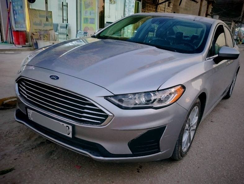 فورد فيوجن 2020 بجم كبس شركة 
محرك 1500 تيربو اقتصادي وقوى ( بانزين عادي) 
رزانة وعزل صوت
حادث خلفي على يمين الجنطة (بجم كبس شركة) 
رقم اربيل دولي وتحويل ثاني يوم باسمك
المسافة المقطوعة 50 الف
بصمة تشغيل عن بعد / كود دخول الابواب / كير ماوس/ هاند بريك بصمة / رادار مانع تصادم وتوقف ذاتي / نظام النقطة العمياء / رادار تنبيه خروج عن المسار / مثبت ستيرن / داخل كشنات جلد اسود / اشارة بالمرأة وتحكم كهرباء / تحكم ستيرن / مانع انزلاق / ردار أمامي وخلفي / حساسات وكاميرا خلفية مسار / تبريد قطعتين أمامي وخلفي وتحكم مناخلمن / المقعد الامامي كهربائي / كروز سرعه /

مقعد خزن / تخم تاير ويل 17 / أوامر صوتية / مدخل USB عدد 3 / سماعات عدد 8

-------------------------------------
بيها تعديل حسبة شبر في نفس مكان الحادث الوارد
مسويلها صيانة كاملة
مكان السيارة بغداد - الكرخ
السعر 126 وبيها مجال حك الجيه
الجادين الاتصال على الرقم واتساب

***********
