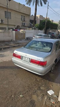عندي سيارة ملكة 2001 فول محرك 3000 باسمي رقم سليمانيه  المكان بغداد مع...