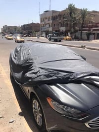 جادر مطري ثقيل • مبطن بطبقة قطنية • جيوب للمرايا