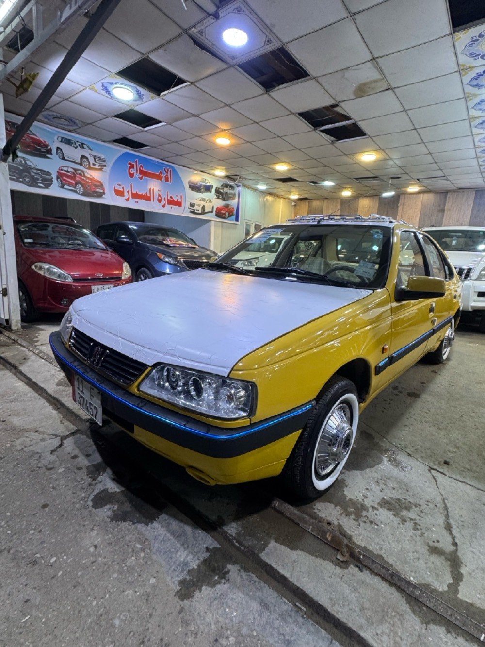 السيارة معروضة للبيع، تتميز بلونها الأصفر اللامع وحالتها الجيدة. السيارة نظيفة من الداخل ومصانة بشكل جيد. جميع التفاصيل والتجهيزات موجودة وتعمل بكفاءة. جاهزة للاستخدام اليومي أو للعمل التجاري كسيارة أجرة.