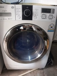 غسالة أوتوماتيك • ١٨ كيلو • مكوى داخلي