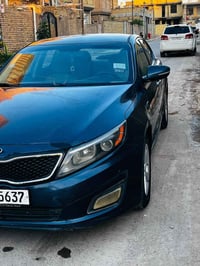 كيا او بتميما موديل 2015 وارد امريكي بيها ضربه بسيطه جاملغ الايمن محرك...