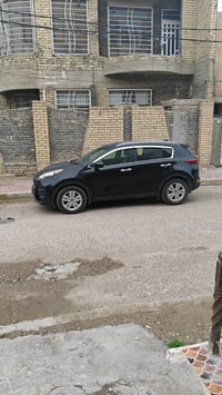 كيا سبورتج وارد امريكي ضرر باب لون اسود رقم واسط