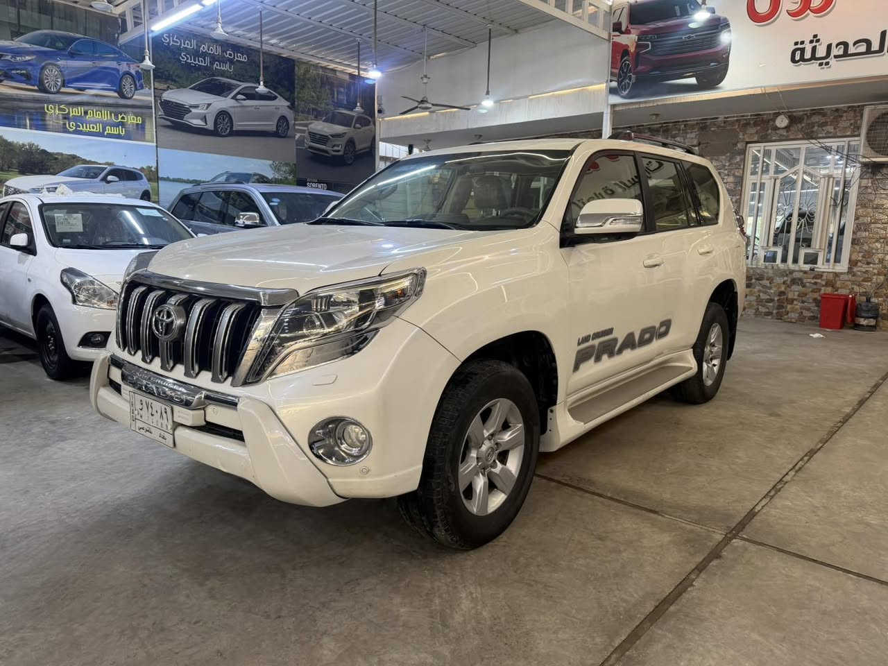 🔷 معرض الإمام المركزي 🔷
📍 العنوان: بغداد – الكريعات – شارع الوقف السني

⸻

🚘 تويوتا برادو 2014 VX
🔹 فول مواصفات – رقم بغداد

المواصفات:
 • بصمة فتح وتشغيل
 • مقاعد جلد
 • كراسي كهرباء
 • تبريد كراسي (أمامية + خلفية)
 • لايت زينون
 • زراك لايت
 • ستيرن كهرباء
 • 6 سلندر
 • محرك 4000
 • 7 ركاب
 • 3 قطع
 • عداد المسافة: 114,000 كم

الحالة:
 • السيارة بيها شخوط خفيفة (غير قوية) جهة عكس السائق
 • بارد بمقدار إصبعين بالبلب، والباقي مكفول

⸻

💰 السعر: 320$
✔️ مجال بسيط

⸻

📞 للاستفسار:
***********
***********
