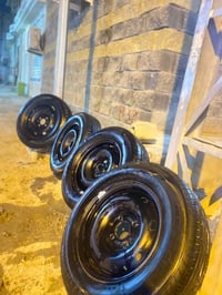 طقم جنط • قياس ١٤ • إطارات شبه جديدة