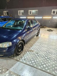 للبيع اوبل استرا 2002 بغداد انكليزي وبسمي كير ومحرك  تبريد ثلج تدفئه ك...