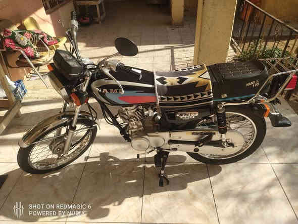 نامة اصلي موديل 2023 الدراجة محجوزة سنة كاملة ومضمومة يعني ما ماشية السعر مليون ونص قفل مابي تفاوض عنواني الكوت حي الزهراء الرقم ***********
