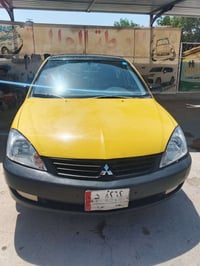 لانسر موديل ٢٠١٠ خليجي سابقه كفاله عامه انطخت عندي بل جنطه  يعني قطعه ...
