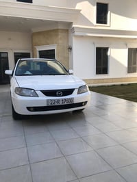 مازدا ٣٢٣ • ٢٠٠٤ • مصبّوغة