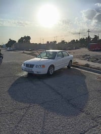 كيا اوبتيما 2004جاهزه من كلشي صبغ عام تبريد مكينه حداديه تخم تاير سيار...