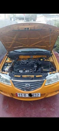 نيسان سني 2011 شركه العامه لسيارات گير عادي رقم جديد النگليزي  بيه صبغ...