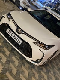 تويوتا كورولا هايبرد 2025 HEV رقم بغداد  ماشيه 11 الف كيلو  1.8 مكينه ...