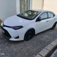 كورولا ال اي • ٢٠١٧ • ابيض ثلجي