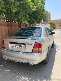 مازدا ٣٢٣ • ٢٠٠١ • استمارة حتى ٢٠٣١