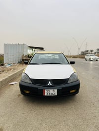 لانسر ٢٠١٠ • مكينة ٢٠٠٠ • رقم بغداد دولي