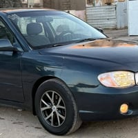 سبكترا موديل 2001 كير اوتو كير مكينه مكفولات  رقم بغداد بأسمي تبريد ثل...