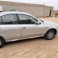 نيسان سني موديل 2000  محورة بيه قطعتين صبغ  مكاني كوت 07801153155