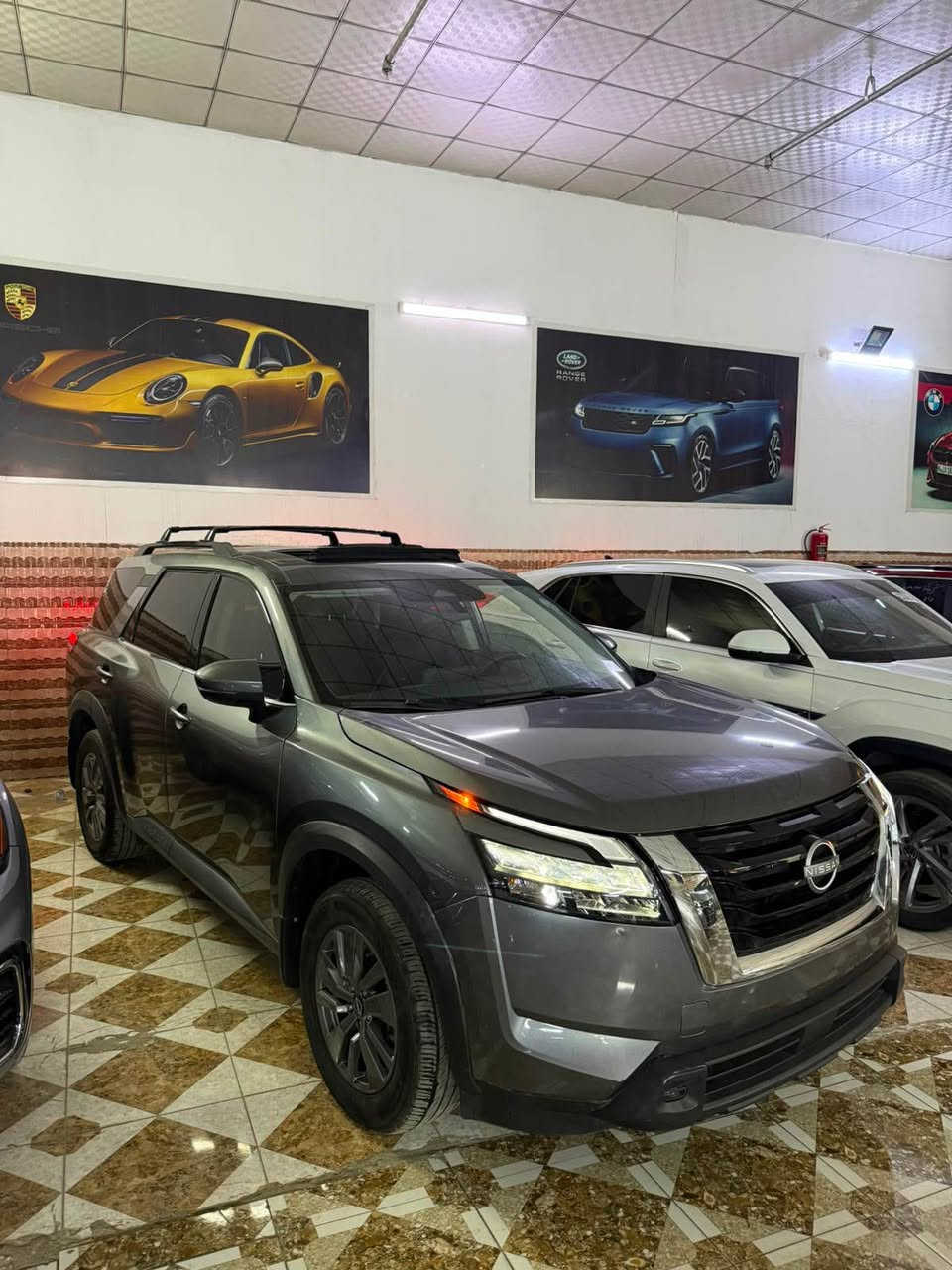 *تحية طيبة لجميع المتابعين*
NISSAN PATHFINDER SV
موديل 2024 فول مواصفات. 
العداد 21 الاف ميل فقط 👌
حجم المحرك 3500 V6. 
رقم الشاصي 5N1DR3BB5RC294946

المواصفات 
*دخول ذكي. 
*كاميرا خلفية. 
‏*نقطة عمياء. 
*تحديد مسار. 
*سقف بانوراما. 
*صندوق كهربائي. 
*حساسات خلفية. 
*فول تحكم في المقود. 
*شاشة كاربلي اندرويد.  
‏*مقعد السائق كهربائي. 
*7 مقاعد VIP مُنفصل. 
*تبريد مركزي 3 قطع. 
*رادار امامي وخلفي وجوانب. 
*بصمة تشغيل وتشغيل عن بعد. 
*غيار اوتماتيك 9 سرعات مع تبديل يدوي في المقود. 

السيارة بدون صبغ شرط الفحص. 
الشواصي سليمة شرط الفحص. 
جميع الإرباكات سليمة شرط الفحص. 

السيارة كاتي تترقم شمال العراق 
أربيل * سليمانية * دهوك 

‏**** السعر. 250  ****

السيارة موجودة في محافظة اربيل للاستفسار

اربيل  شارع المعارض 
او الاتصال على الرقم 
*********** أربيل, العراق
