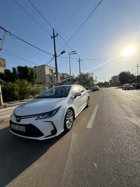 كورلا هايبرد مديل 2025 السياره مكفوله كفاله عامه  فول رقم بغداد بسمي ا...