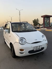 كيو كيو 2013 رقم بغداد انكليزي سياره نضيفه بدون صبغ محرك وكير جدد تبري...