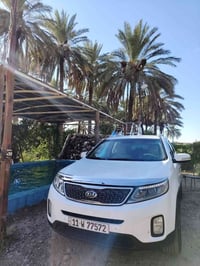 سورنتو 2014 V6 خليجي مكفول من ضربه و من صبغ 3قطع تبريد 7 راكب  رقم بغد...