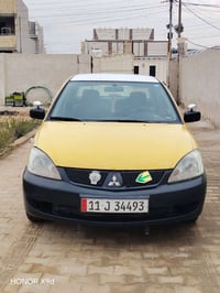 لانسر 2009  رقم بغداد دولي بسمي سياره خير من الله مكينه 2000 على أيدي ...