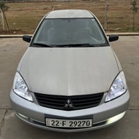 میستۆبۆشی لانسەر 2010  گێر تۆماتیک  پێنج پارچەی بۆیاخە  بە حیزام دەیفر...