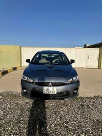 ميتسوبيشي لانسر خليجي للبيع  موديل 2016  السياره عليها تعديلات واضافات...