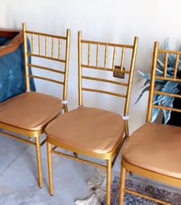 كراسي عدد ٦٠ تقريباً ذهبي حديد نضيفه للبيع وكراسي عظم عاج ابيض ٣٥ كرسي...