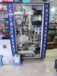 عارضة اكسسوارات • ١٫٢٥×٢م • رفوف زجاج ١٠مم