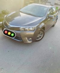 كورلا خليجي موديل 2014 لون رصاصي  رقم بغداد الجديد  محرك 1600  ماشية 1...