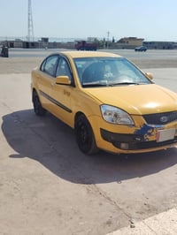 كيا ريو امريكي  موديل 9 رقم بغداد الماني هيئه غرمات صفر  مبدل بيها ارب...