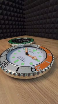 ساعة جدارية • تصميم رولكس