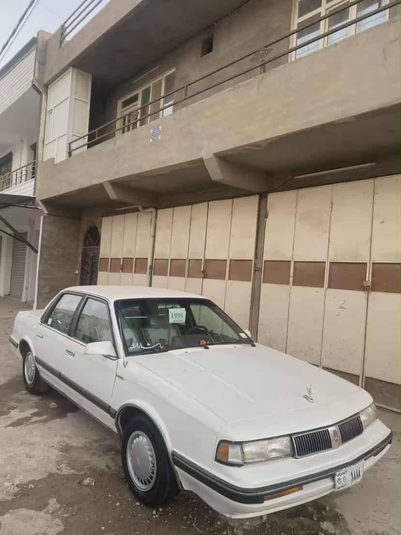 ئؤلدز 1991 گيرومحرك شرط شرت تحويل تا يه را ت جديد كا رع با ي كول عيب ما كو ره قه م مو با يل *********** كركوك, العراق
