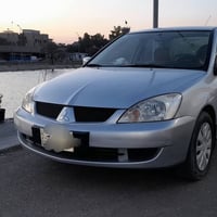 لانسر2011 أستلام شركه سياره مصبوغه حزام بسبب الجراد مكفوله من الضربه و...