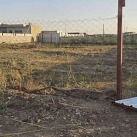 للبيع... ارض طابو زراعي المساحه ٩٠٠ متر خلف حي الجامعه مسيجه سند ٢٥ لل...