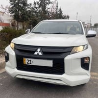 میسیوبوشی L200 2023 تاک ئەکسل سفری شەریکەی نوێکار تەختە 56000 Km ڕۆشوو...