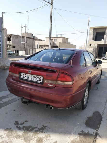 مازدا فاصوليا للبيع محرك 6 سلندر بدون صبغ تبريد شغال كابون بانزين كير و محرك شرط موديل 93    50 وبيها مجال
